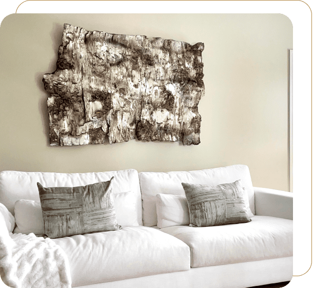 White sofa with abstract wall art above.