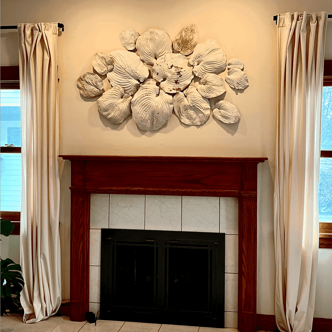Fireplace with shell wall art decoration.
