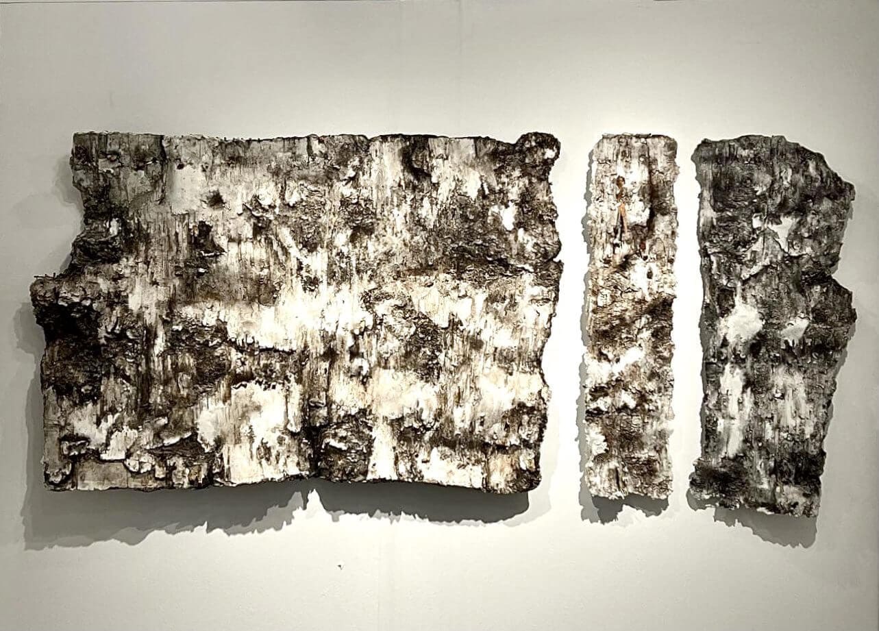 Ancient fragmented manuscript with faded text on aged material.