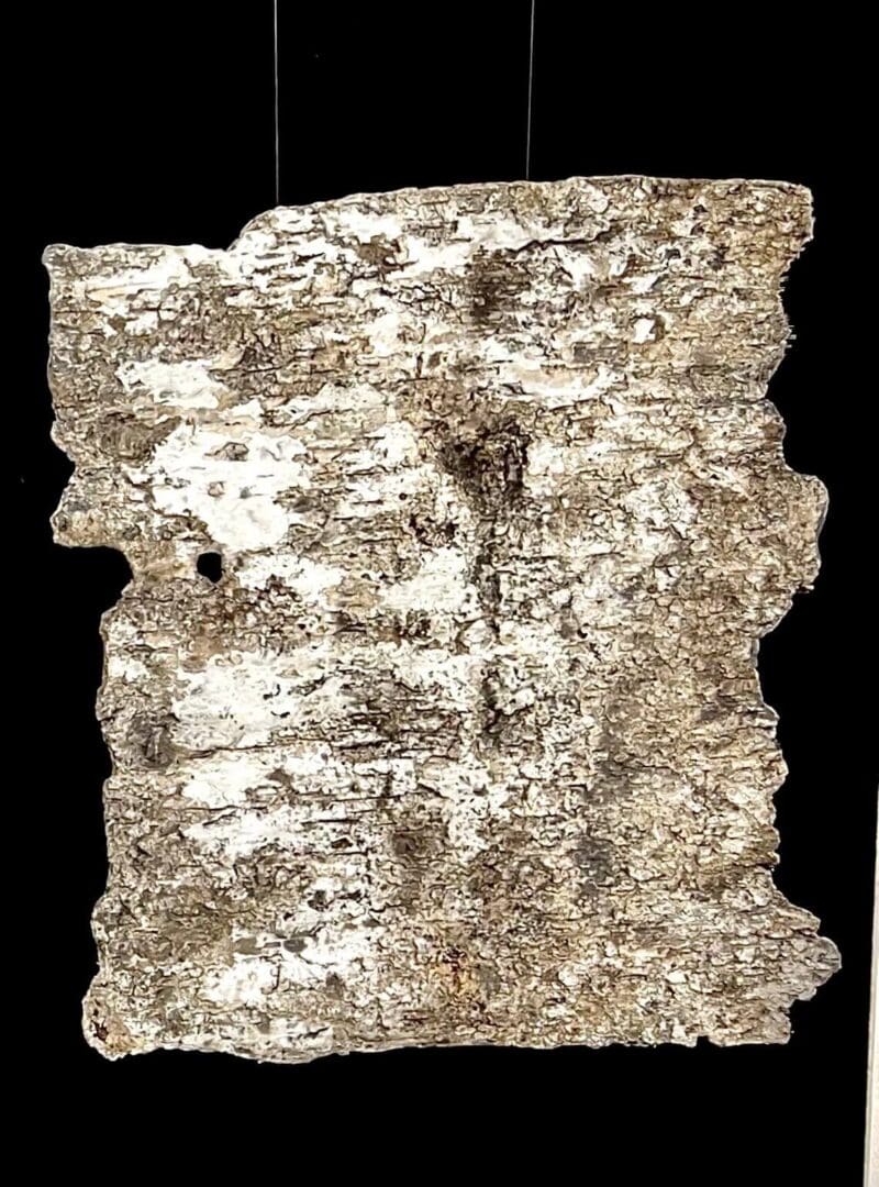 Ancient clay tablet with cuneiform script.