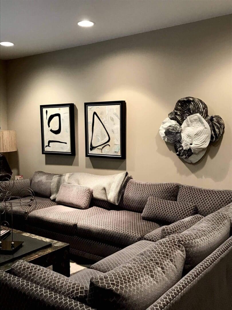 Modern living room with abstract art and a cozy sectional sofa.