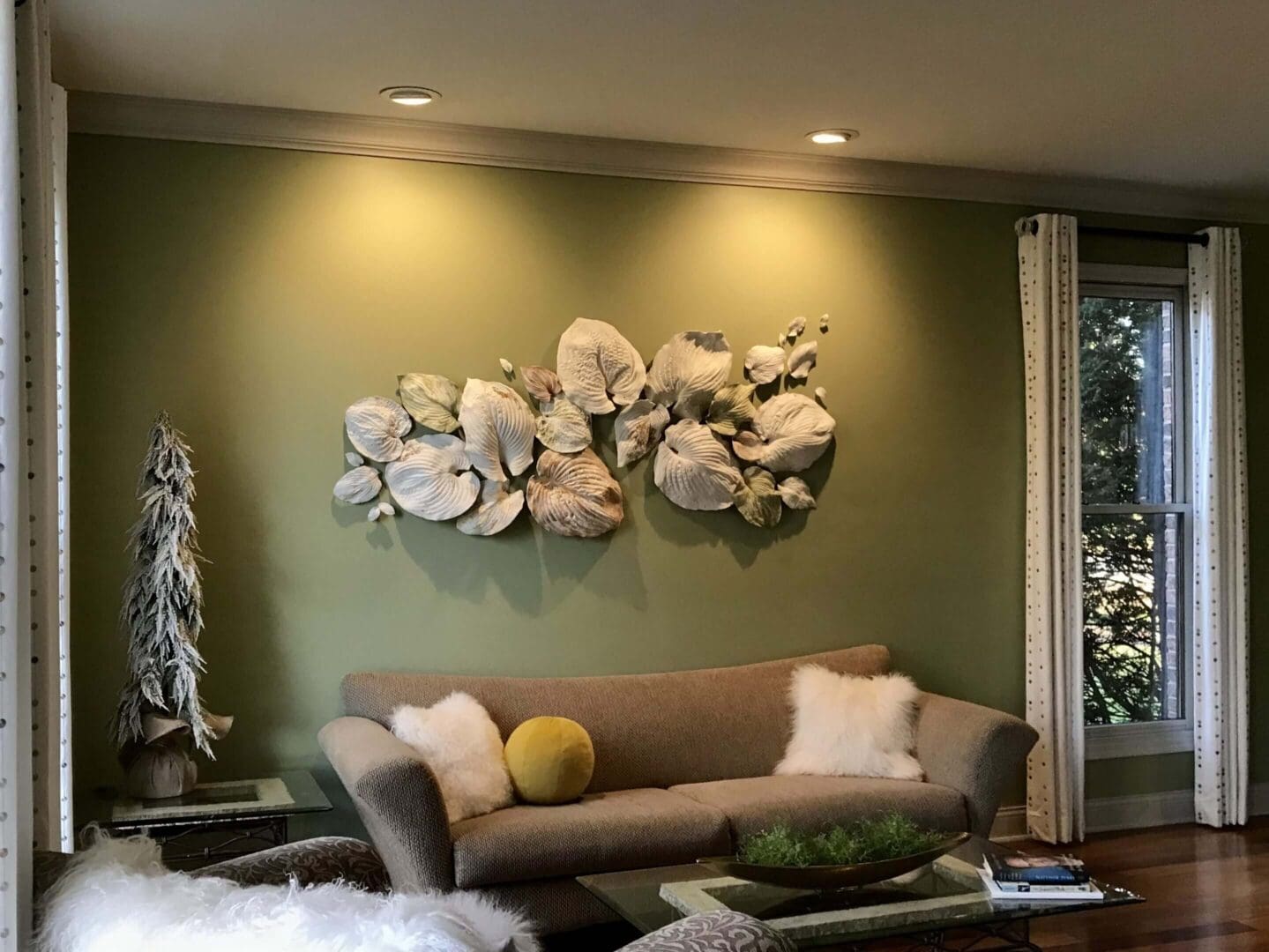 Modern living room with artistic wall decor and cozy seating.